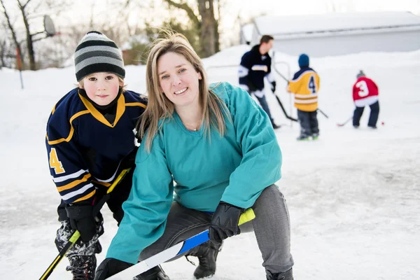 A Mother and son playing hockey having fun — Stock Photo, Image