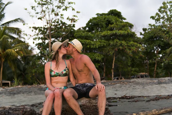 Couple in love having romantic tender moments at sunset on the beach — Stock Photo, Image