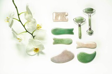 Guasha massage scrapers and rollers of different shapes and colors, traditional chinese acupuncture massage clipart