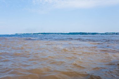 Meeting of Waters .Rio Negro and Rio Solimoes confluence near Manaus. Brazilian landmark clipart
