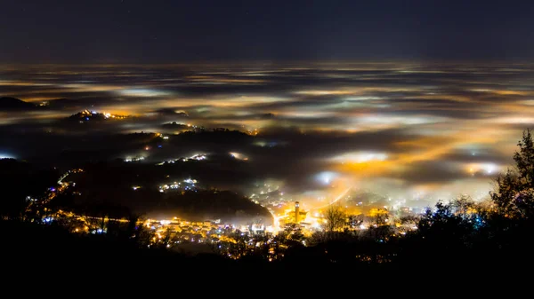 Plain illuminated partially covered by fog, soft lights — Stock Photo, Image