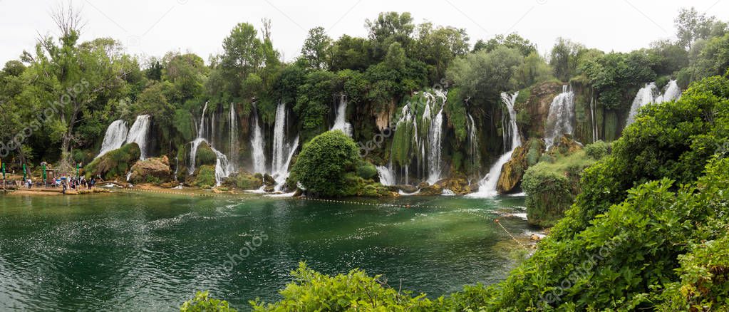 Panorama of beautiful Kravica waterfall in Bosnia and Herzegovina - popular swimming and picnic area for tourists