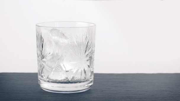Ice Cubes Whiskey Poured Glass — стоковое видео