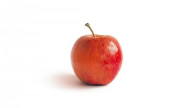 Kırmızı elma üzerine beyaz döner