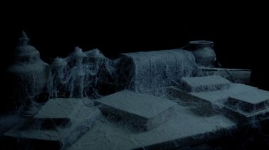 Birini karanlık odada masadan eski kitap alır