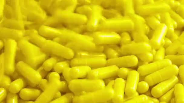 Yellow Health Capsules Poured Pile — ストック動画