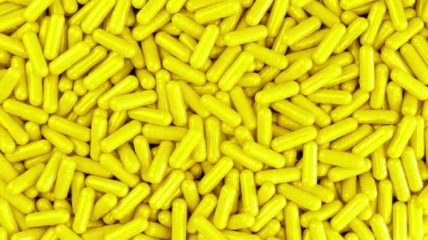 Yellow Health Capsules Pile Top View — Stock Video