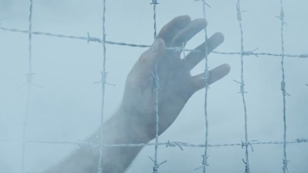 Hand Prison Wire Passing Smoke — Stock Video