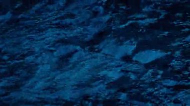 Surface Of River Flowing In The Dark