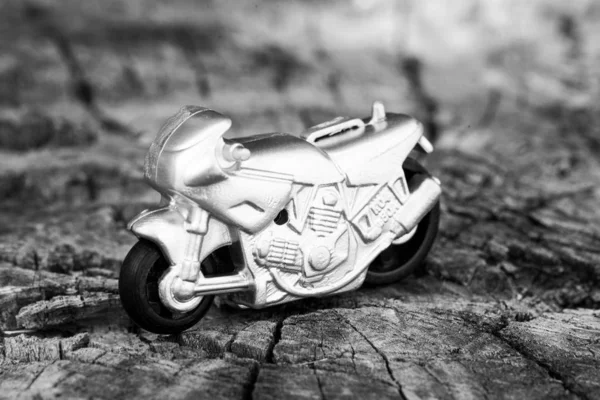 Small toy gray sports bike.