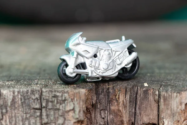 Small toy gray sports bike.