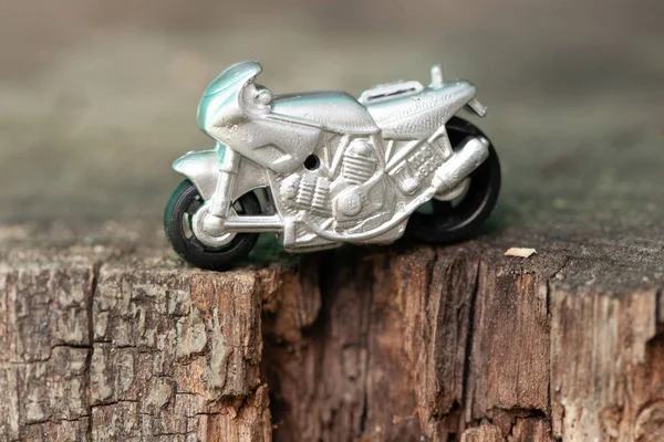 Small toy gray sports bike.