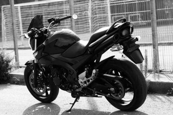 Black motorcycle close-up on the street.