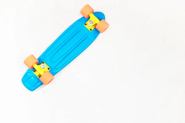 Skateboard cruiser style blue yellow and orange view from above