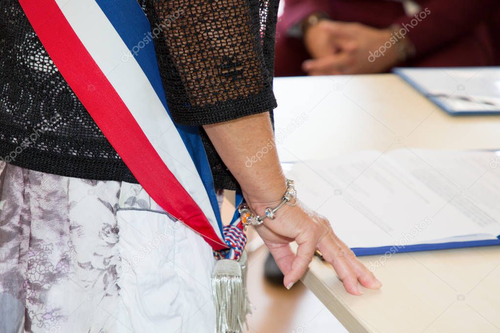 French mayor woman with ceremony scarf flag during weeding day celebration