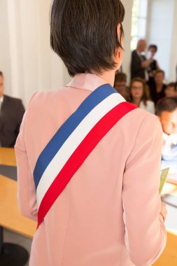 French mayor woman with a scarf flag blue wghite red during ceremony weeding day clipart