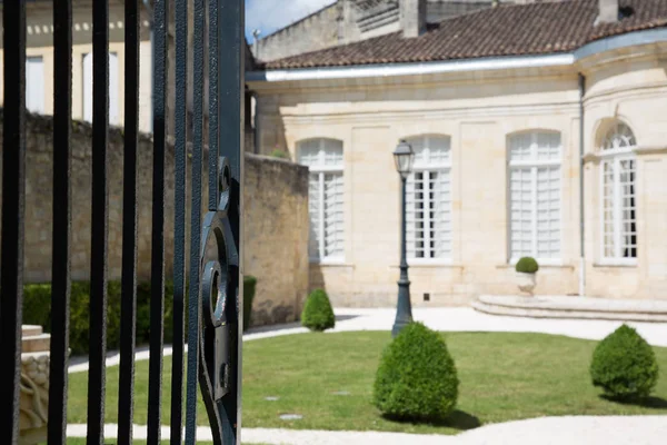 an open gate on a beautiful old house classic south west france