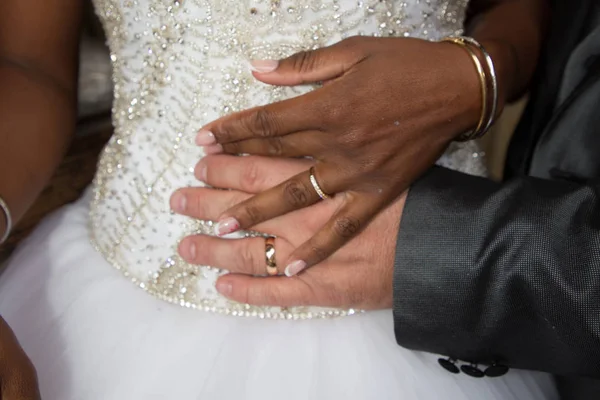 african black bride hand and caucasian rings wedding