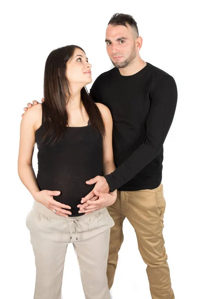 Gelukkig Man Knuffelen Vrolijke Zwangere Vrouw Witte Muur Geïsoleerd Zoek — Stockfoto