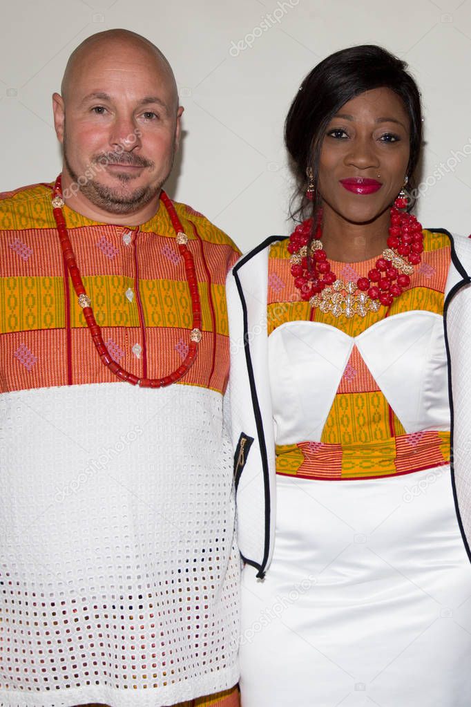 bright ethnic clothes mixed race bride and groom dressed in traditional clothing in wedding ceremony