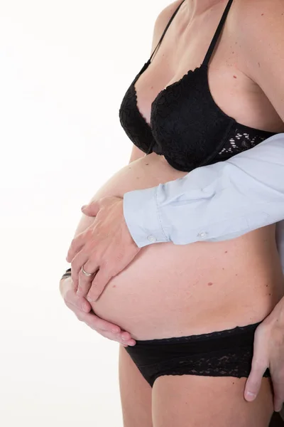 Gravid Kvinna Och Kärleksfull Make Kramas Mage Magen Hemma — Stockfoto