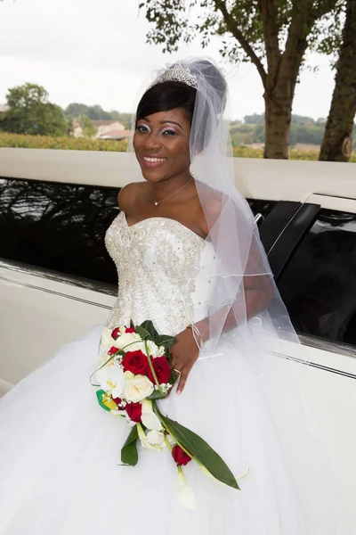 american black bride with limousine wedding car background