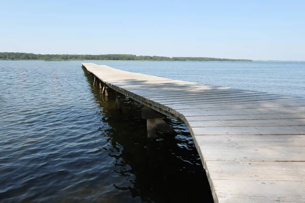 the wooden pontoon on the lake