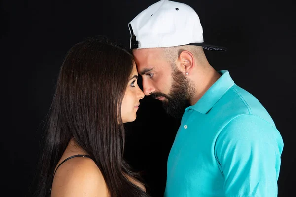 attractive face to face handsome man beauty woman couple in black background