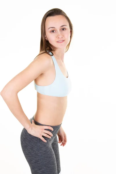 Junge Schöne Frau Sportbekleidung Dabei Stretching Isoliert Über Weißem Hintergrund — Stockfoto