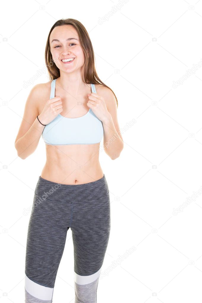 Young muscular girl posing on white background isolated portrait of beautiful fitness young woman