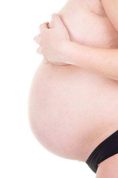 侧视图手孕妇的母亲肚子健康怀孕概念 — 图库照片
