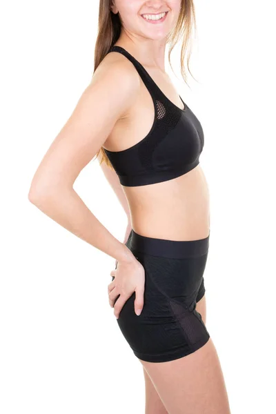 年轻苗条健康美丽的女人在黑色胸罩短运动健身服积极穿 — 图库照片