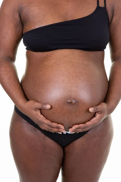 孕妇非洲裔美国起源抱着她的肚子 — 图库照片