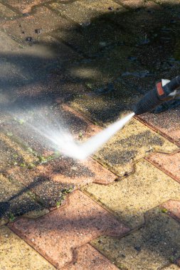 Outdoor floor cleaning with high pressure water jet clipart