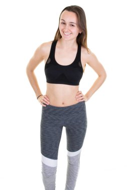Beyaz arka planda izole sporda ince fit ve sportif genç kadın mükemmel gövdesi