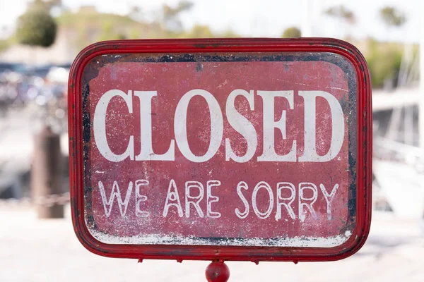 business vintage sign that says \'Closed  We are sorry\'