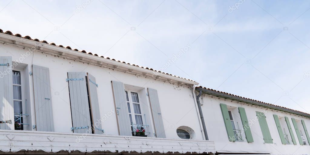 Saint Martin de Re picturesque color shutter village center in web banner template