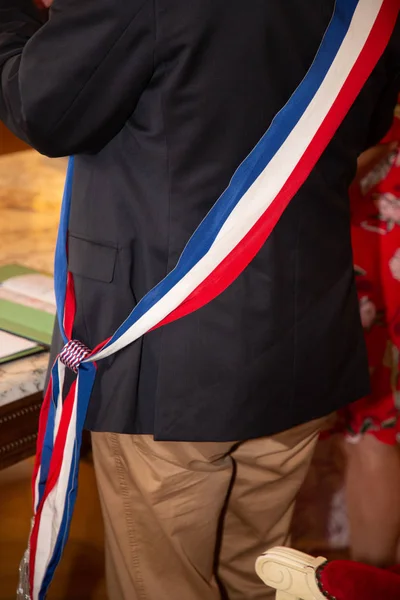 french tricolor mayor man scarf during ceremony in France