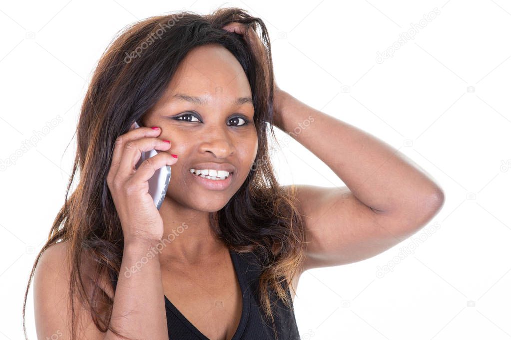 American african happy woman smiling and speaking on smart mobile phone isolated over white background
