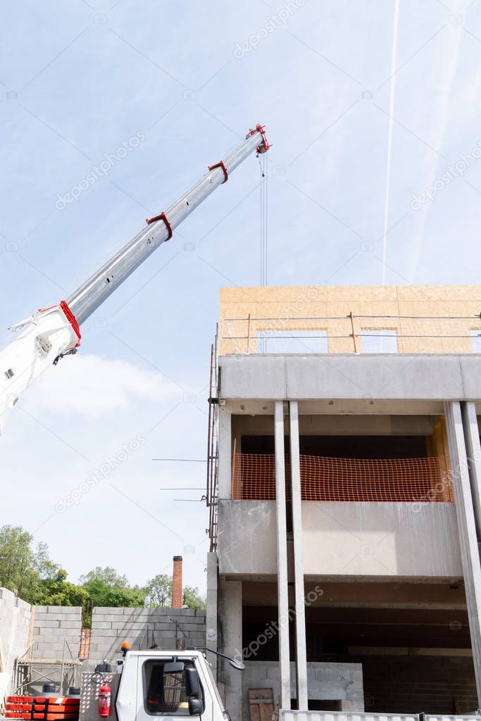 truck crane in building construction site
