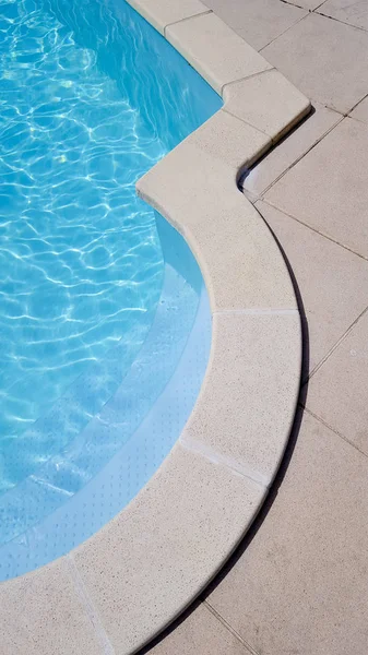 Detail of modern outdoor blue swimming pool top view