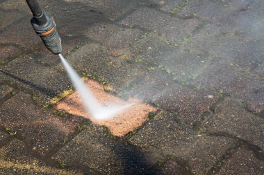 sidewalk concrete block floor clean with high pressure water jet clipart