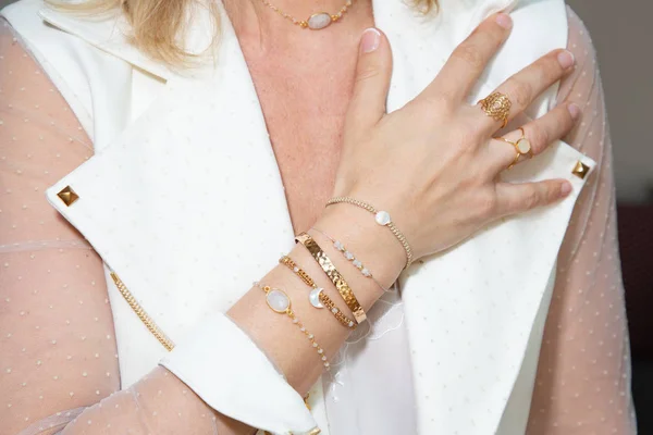 woman hand with jewelry rings and bracelets