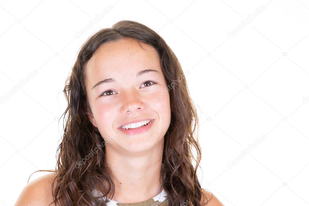 smiling pretty girl teen model having fun isolated on blank white studio wall portrait