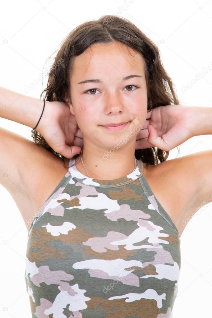 Young brunette teenage girl isolated on white background hands on hairs head