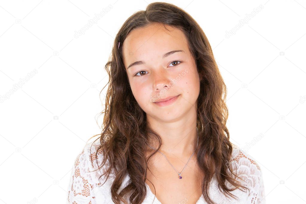 Happy brunette teen girl smiling and looking at camera