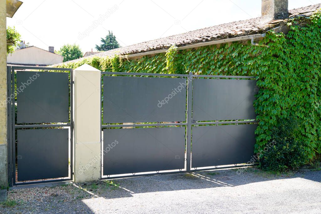 steel dark gray paint metal gate house portal of suburb home door
