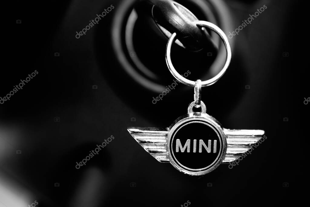 Bordeaux , Aquitaine / France - 07 25 2020 : MINI car logo wings and text sign on silver keychain in black interior