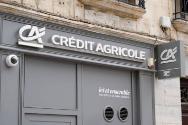 Bordeaux, Aquitaine / France - 07 28 2020: Credit agricole logo and text sign on French Bank Agency cephe grey building white ca