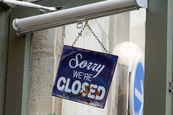 sorry we are closed sign board on door shop restaurant cafe store